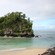 An islet with lush vegetation next to a shoreline